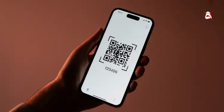 Hand holding a phone with QR code and 6-digit verification number