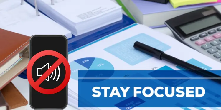 A muted smartphone icon over a desk showing scattered papers and a calculator