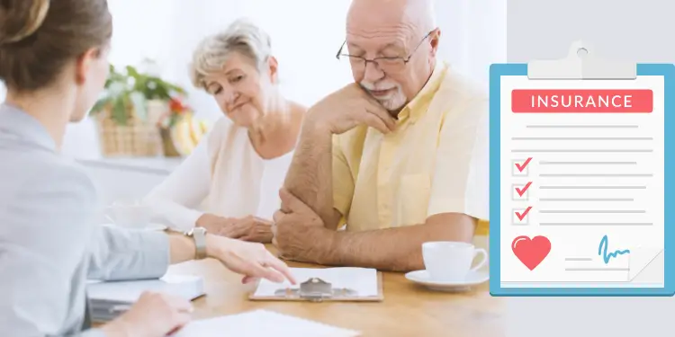 Couple meeting an insurance agent over a clipboard displaying policy checklist.