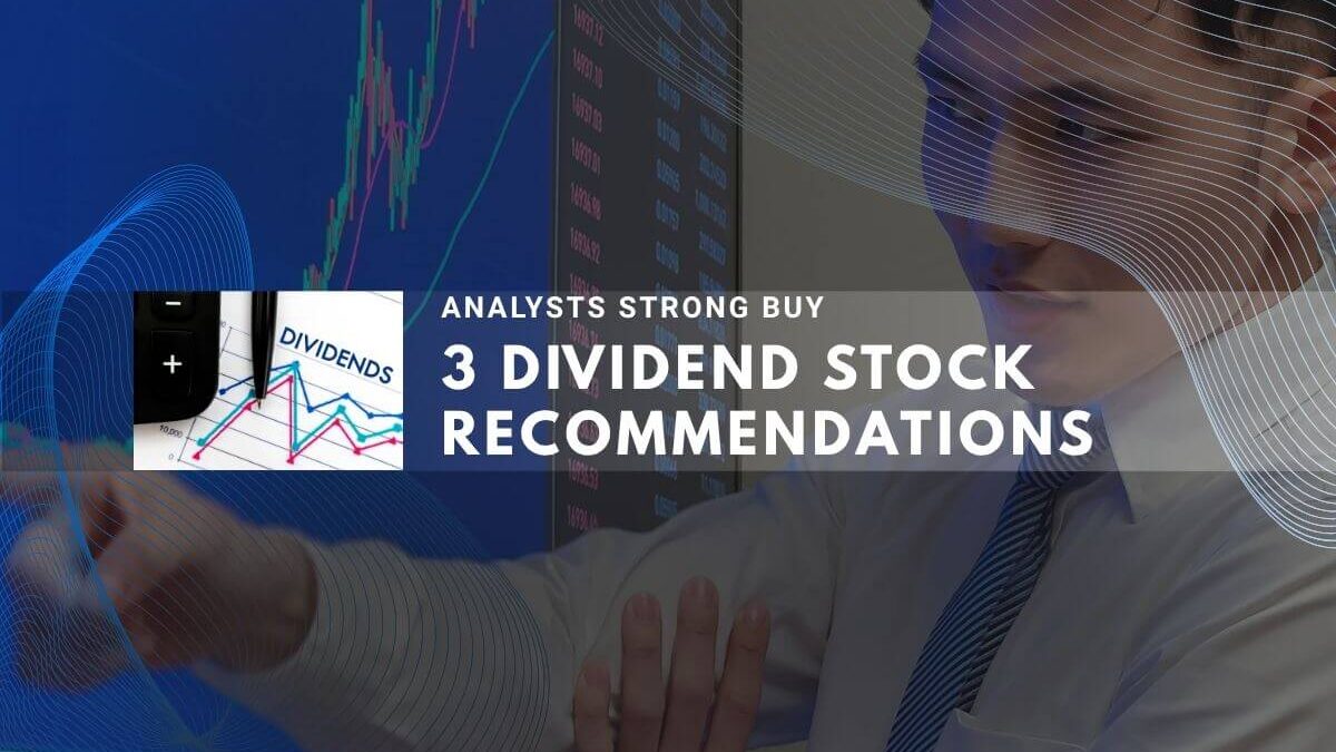 Analyst reviewing stock data with dividend stock recommendations on screen.