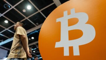 Bitcoin Rises to a Record as ‘Debasement’ Trade Spurs Risk Rally