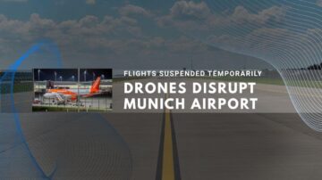 Munich airport runway with planes, flights suspended due to drone disruption.