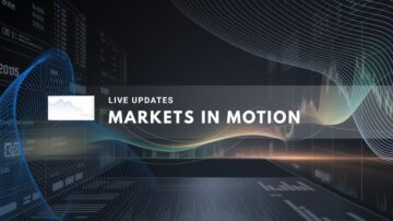 Digital screens display dynamic stock charts and market data graphics