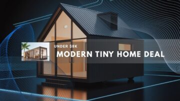 Modern wooden tiny house with large windows in a forest setting