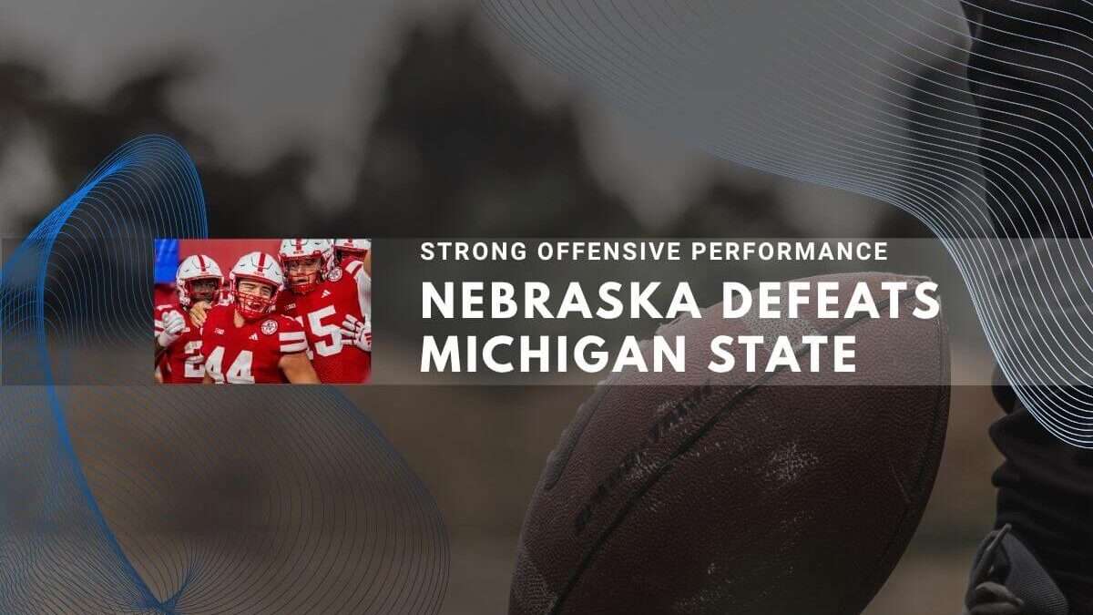 Nebraska football players celebrate victory over Michigan State
