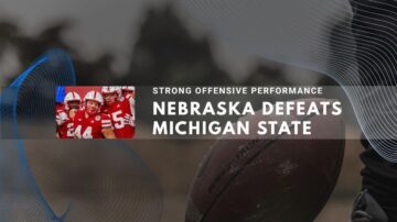 Nebraska football players celebrate victory over Michigan State