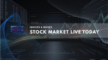 Multiple trading screens displaying fluctuating financial charts