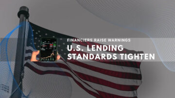 American flag with hand holding phone showing financial data amid lending warnings