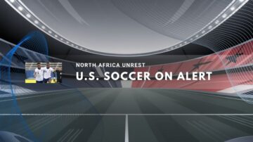 U.S. soccer players on field amid tense international atmosphere.