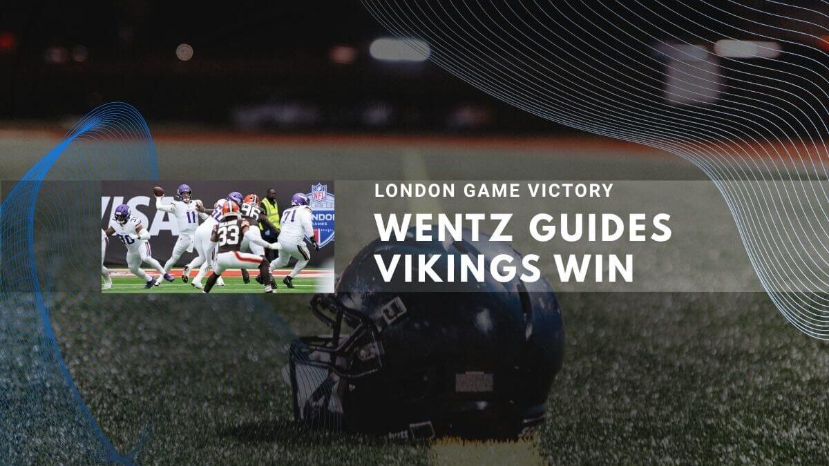 Night stadium with football players and helmets showing Wentz guides Vikings win