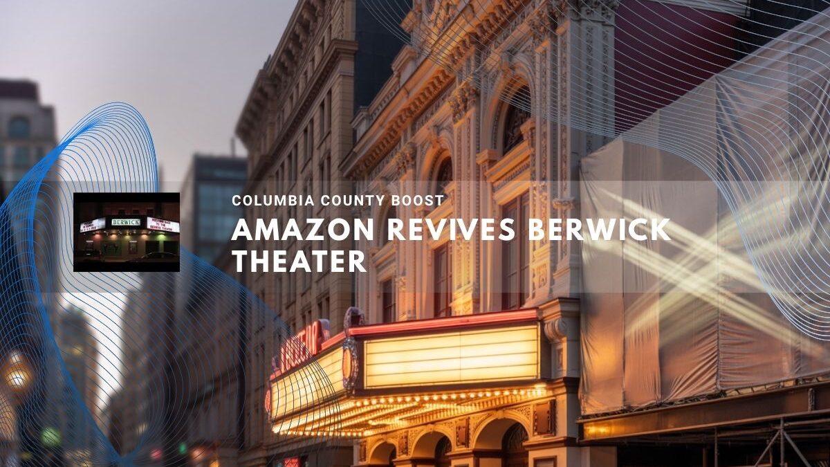 Restored theater with bright marquee lights on a quiet city street.