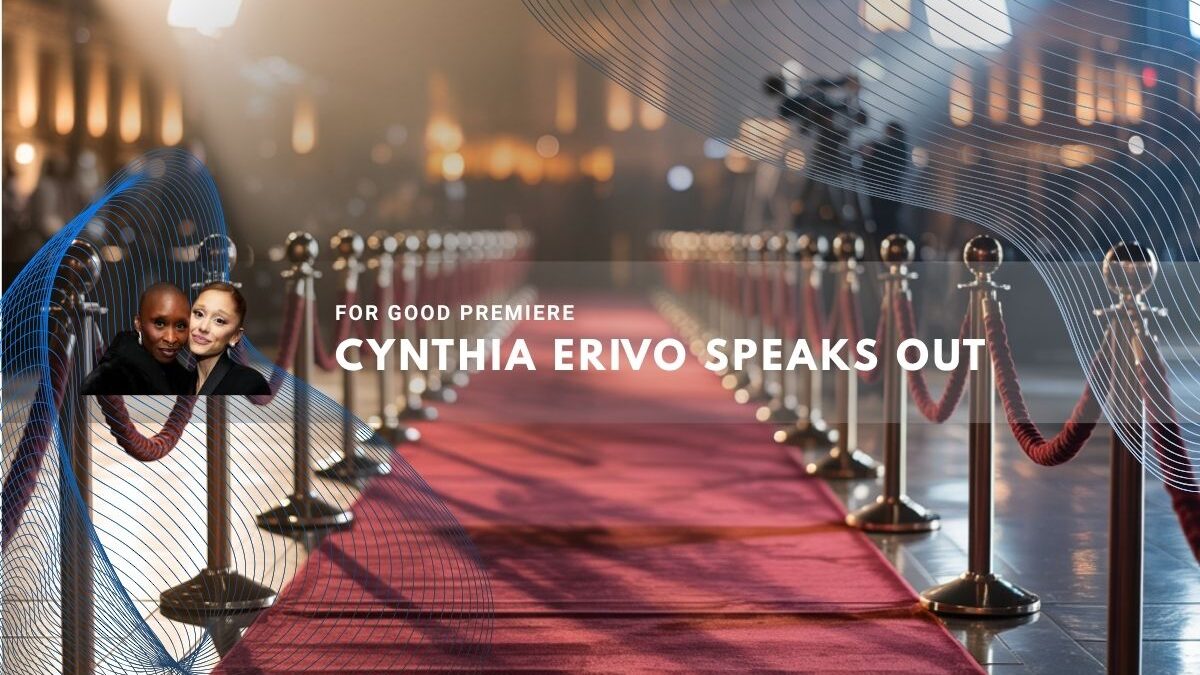 Cynthia Erivo poses near a red carpet lit by spotlights