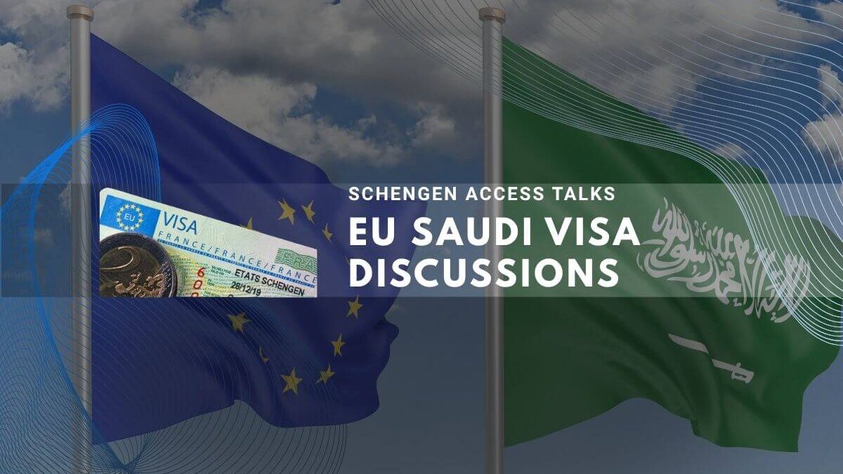 EU and Saudi flags displayed during Schengen visa access talks under clear blue sky.