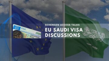 EU and Saudi flags displayed during Schengen visa access talks under clear blue sky.