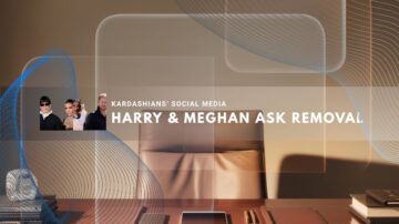 Office desk with tablet, phone, and books lit by soft light.