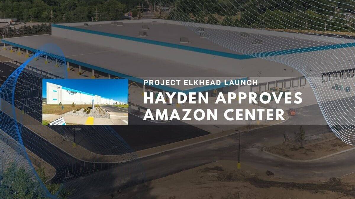Modern Amazon Center building with Project Elkhead launch approval.