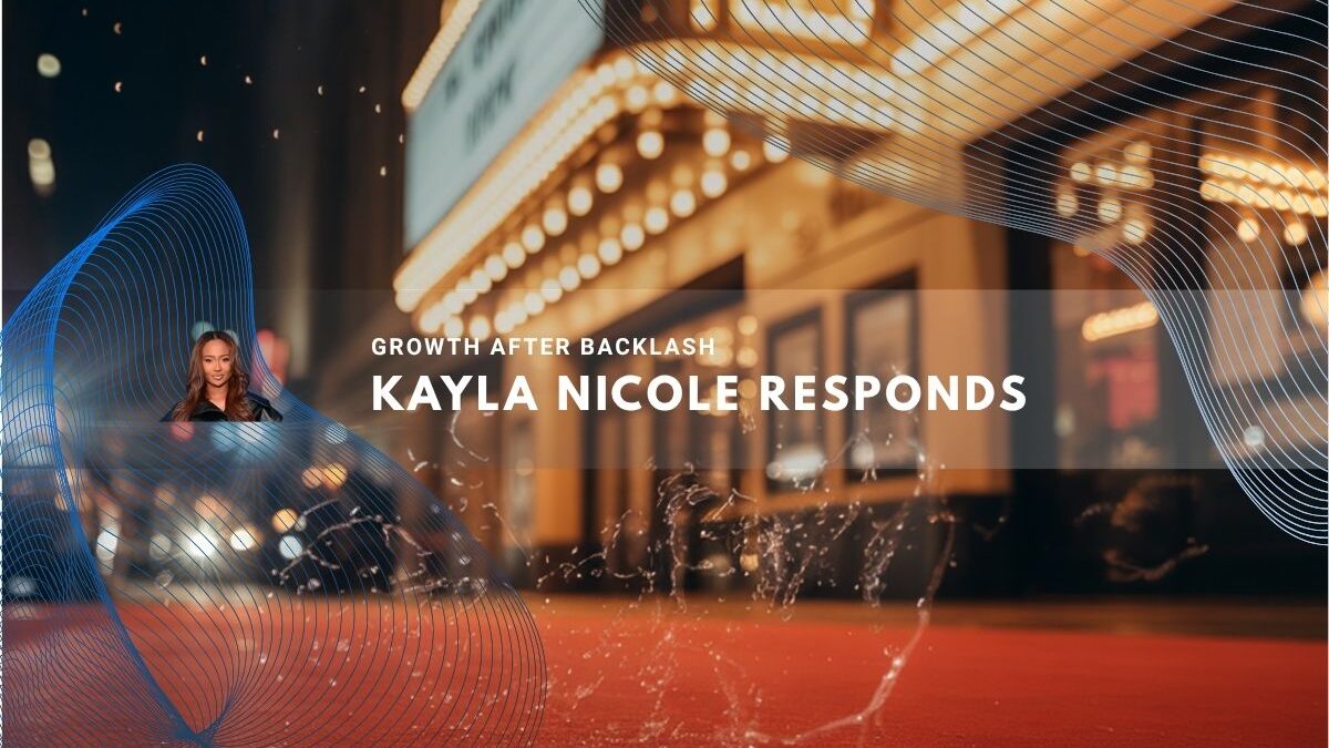 Kayla Nicole pictured by a glowing theater marquee at night