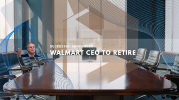 Walmart executive sitting at the head of a large boardroom table