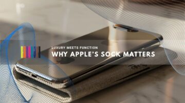 iPhone rests on a sleek fabric sleeve atop a marble surface